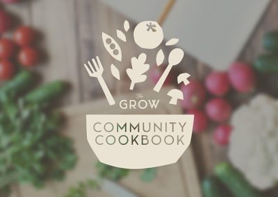 Announcing The Grow Community Cookbook: Sharing Homegrown Goodness - hero graphic including a background of vegetables on a wooden tabletop and in the foreground the cookbook logo